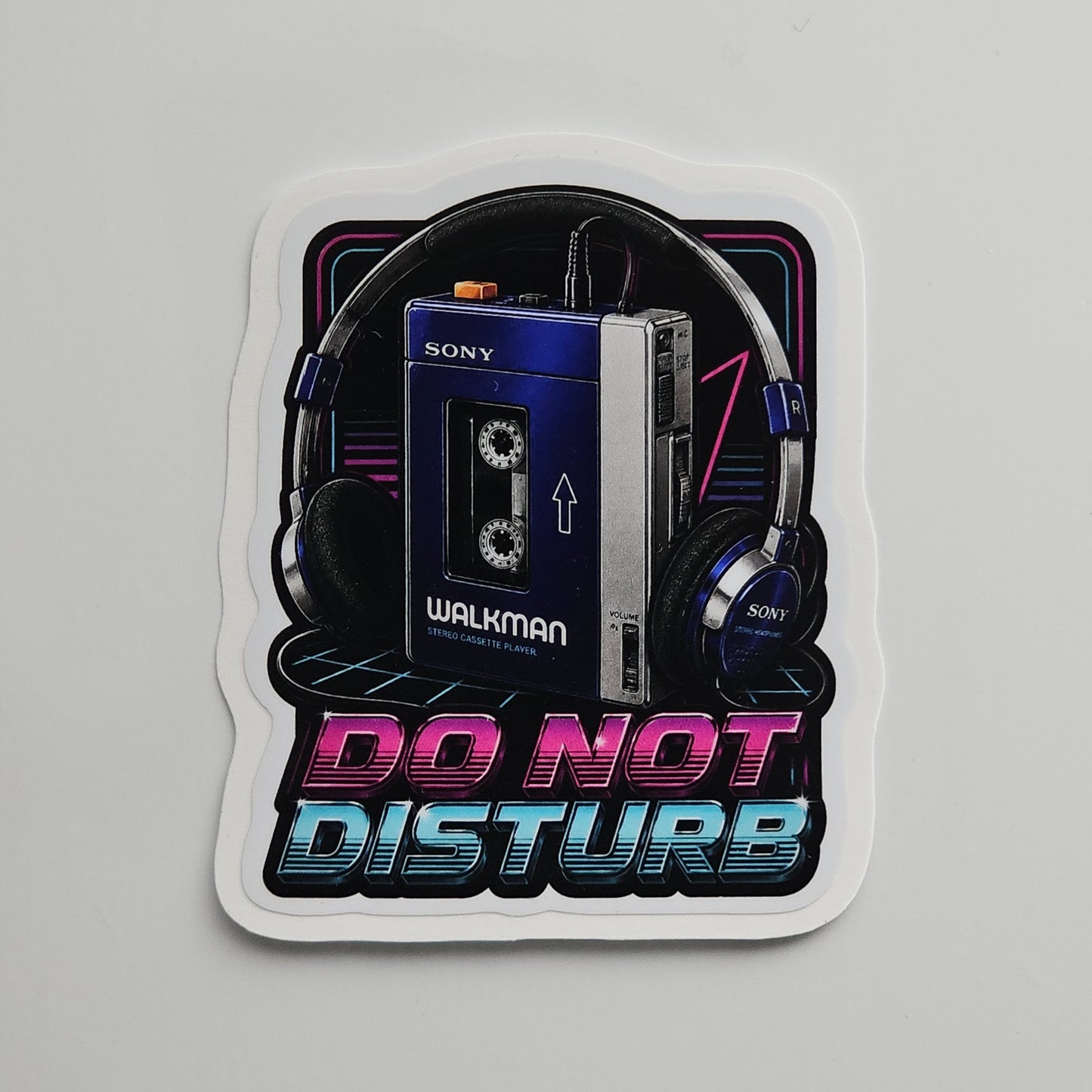 Sticker with a Sony Walkman and headphones design, featuring 'Do Not Disturb' text on a gray background.