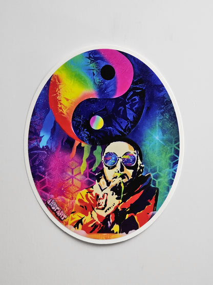Colorful sticker with a yin yang symbol and artistic design on a gray background