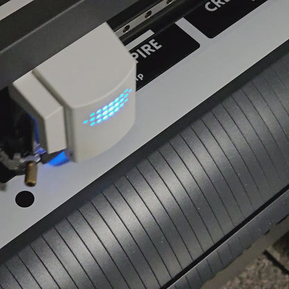 Video of bumper stickers being cut on an industrial cutter machine.